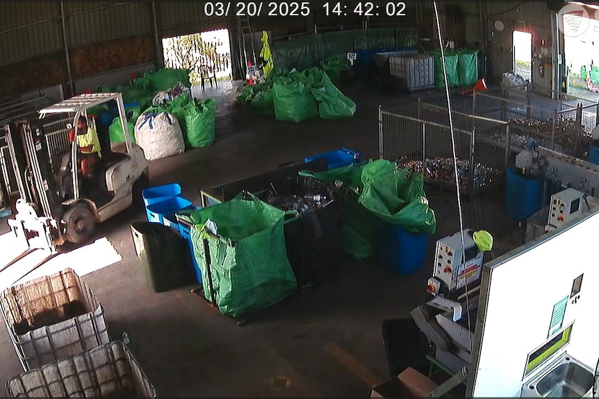 CCTV footage showing a person driving a forklift.