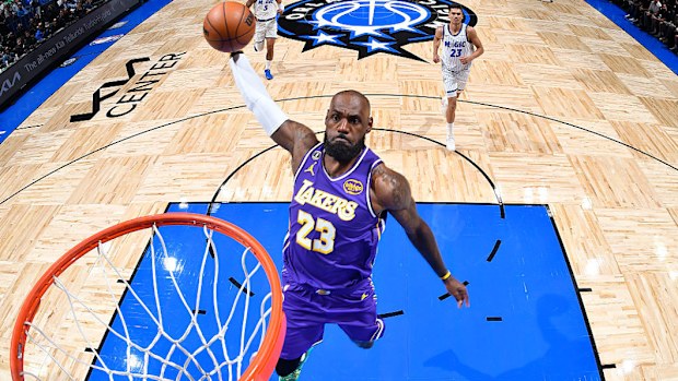 LeBron James dunks the ball.
