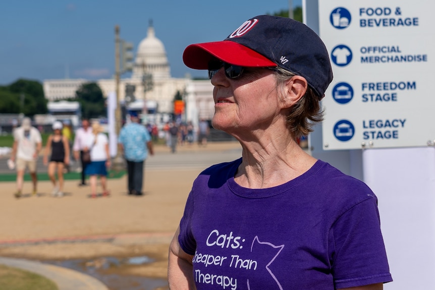 Louise Fenner stands on the National Mall with the US Capitol in the background.