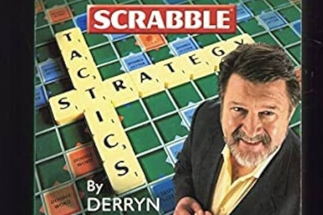 Derryn Hinch in front of a Scrabble board game
