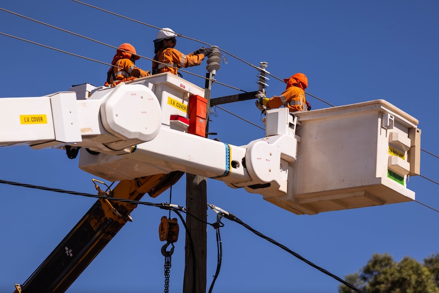 A Western Power crew working at heights to repair a damaged pole.