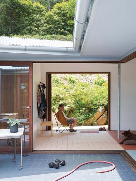 The roof slopes down to the courtyard, capturing northern light and facilitating easy gutter clearing.