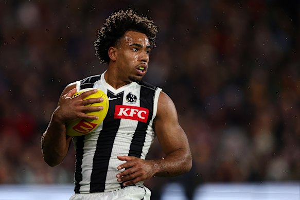 Isaac Quaynor in action against the Crows at Adelaide Oval.