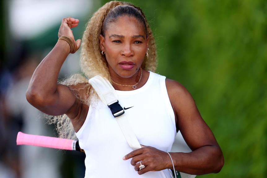 Serena Williams walks to the training grounds at the All England Lawn Tennis and Croquet Club in London.