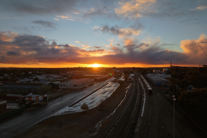A goloden sunset over a rural town