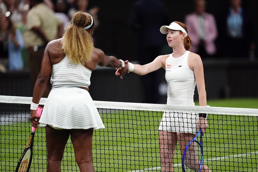 Maya Joint shakes Serena Williams's hand over the net at Wimbledon.