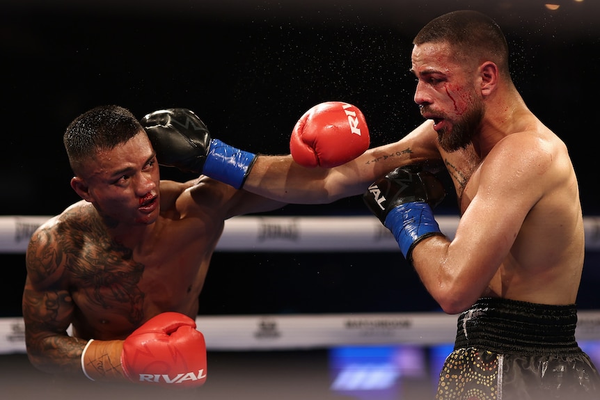 Andrew Hunt and Benjamin Hussain exchange punches during their Super Welterweight bout.