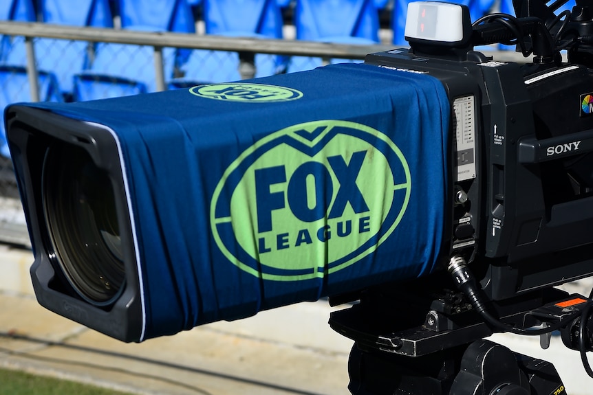 A camera with a Fox League logo on it at an NRL game.