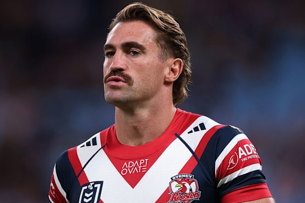 Connor Watson of the Roosters warms up.
