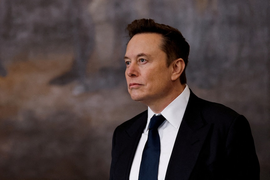 A man wearing a suit and tie.