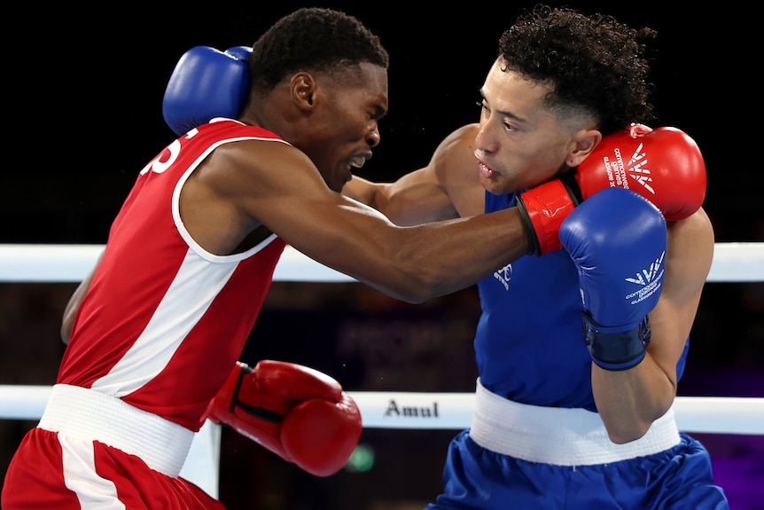 Pooana Khoahli of Team Lesotho and De Niro Pao of Team Niue during a Commonwealth Games boxing bout.
