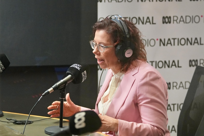 Amanda Rishworth sits with headphone son in the RN studio