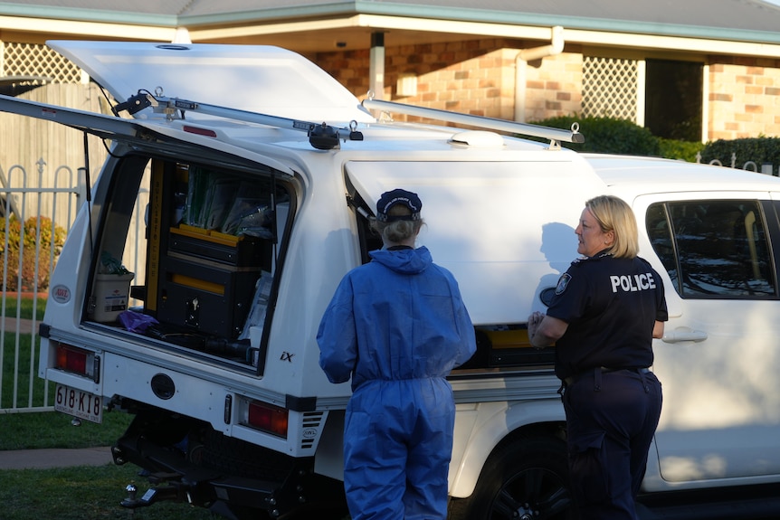 forensic officers at car