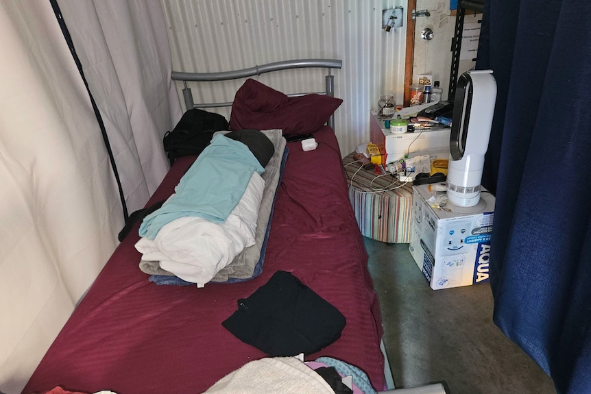 A mattress in a small room.
