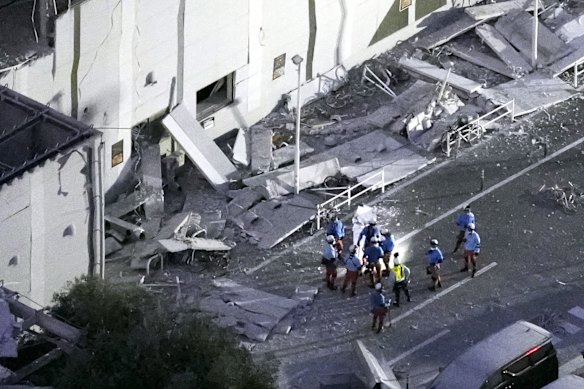 Rescue workers at the shopping centre after the earthquake. 
