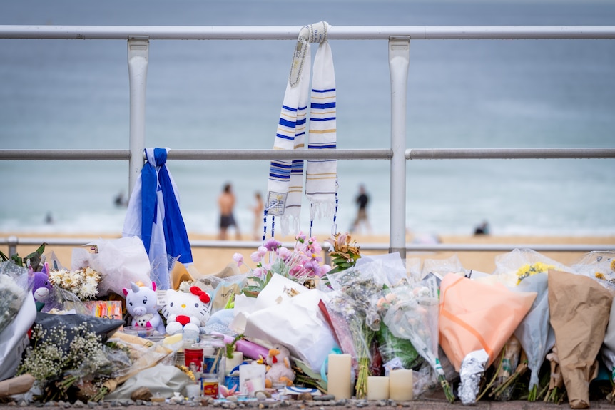 Floral tributes on promenade at Bondi Beach