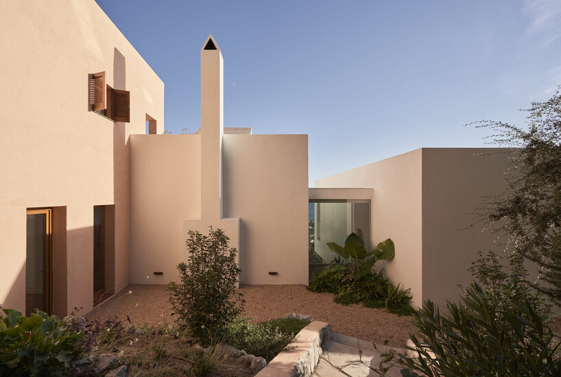 open patios and white geometric terraces extend casa blajot along catalan coast - 3