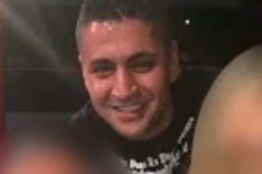 Kazem Kaz Hamad at what appears to be a boxing ring with two people who's faces are blurred out.
