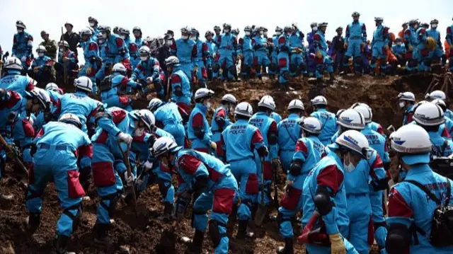 Emergency responders dig holes