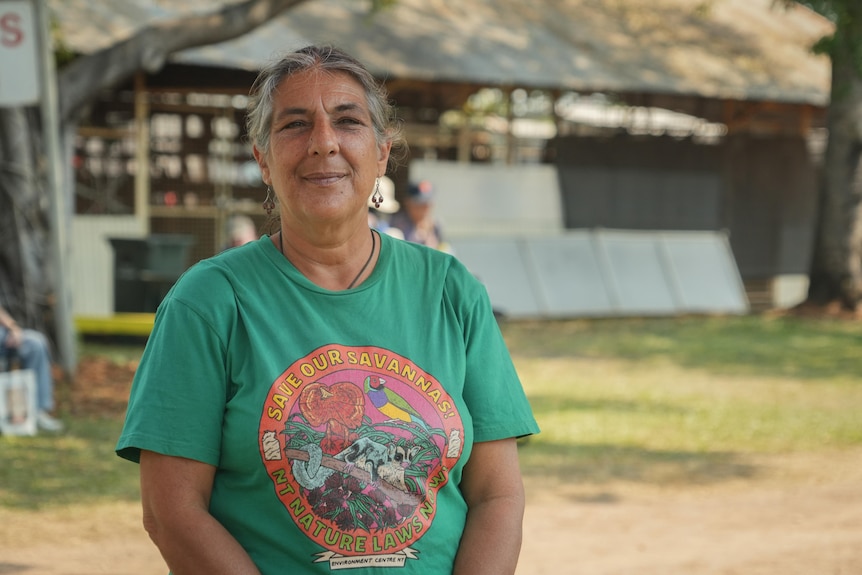 Pauline Cass stands outside wearing a green t-shirt