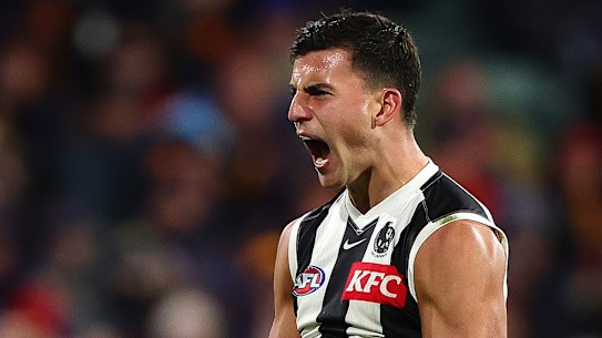 Nick Daicos celebrates a goal.