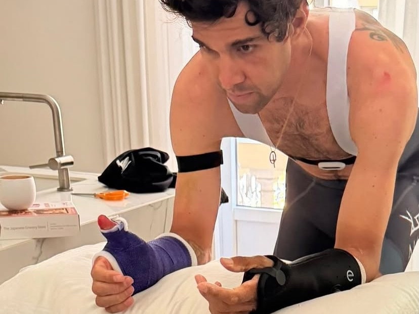 Michael Matthews with his wrists in a cast