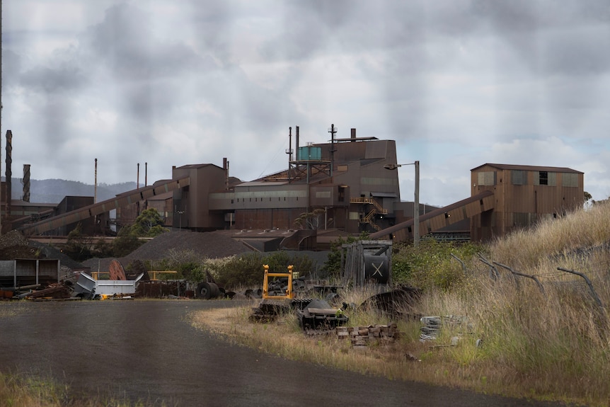 A large smelter looking dark and deserted.