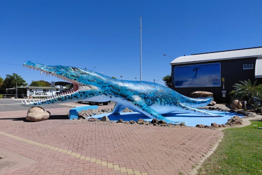 A giant statue of a prehistoric maritime reptile stands outside an outback museum.