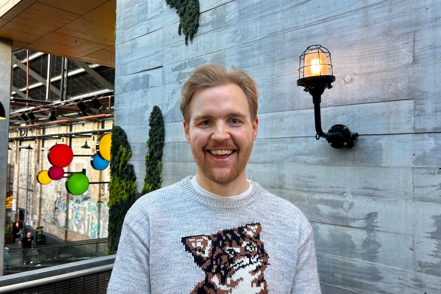 Andrew Nissen smiles as he looks at the camera