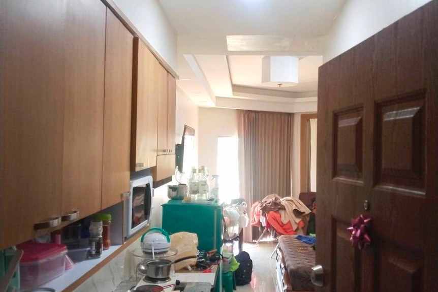 A messy room with bright lighting.