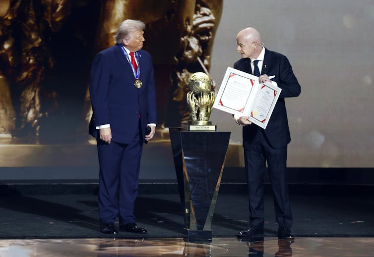 Fifa president, Gianni Infantino, presents the US president, Donald Trump with the 'Fifa Peace Prize'.