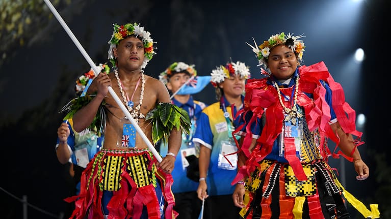 Flagbearer Pasoni Badi Taafaki of Team Tuvalu and King's Baton Bearer Malia Timo of Team Tuvalu lead their team during the opening ceremony ahead of the Glasgow 2026 Commonwealth Games.