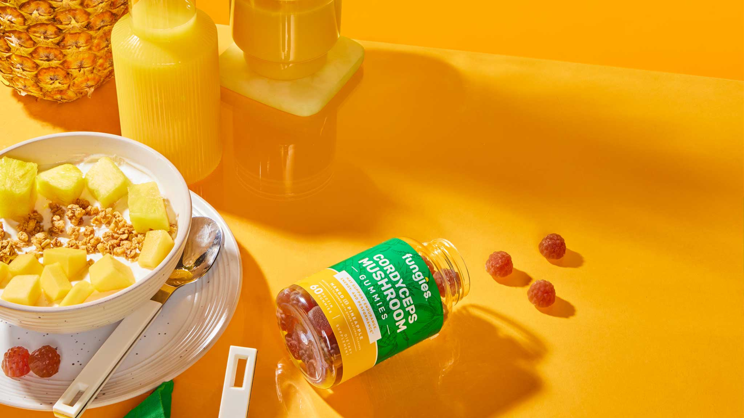 fungies mushroom gummies on orange backdrop