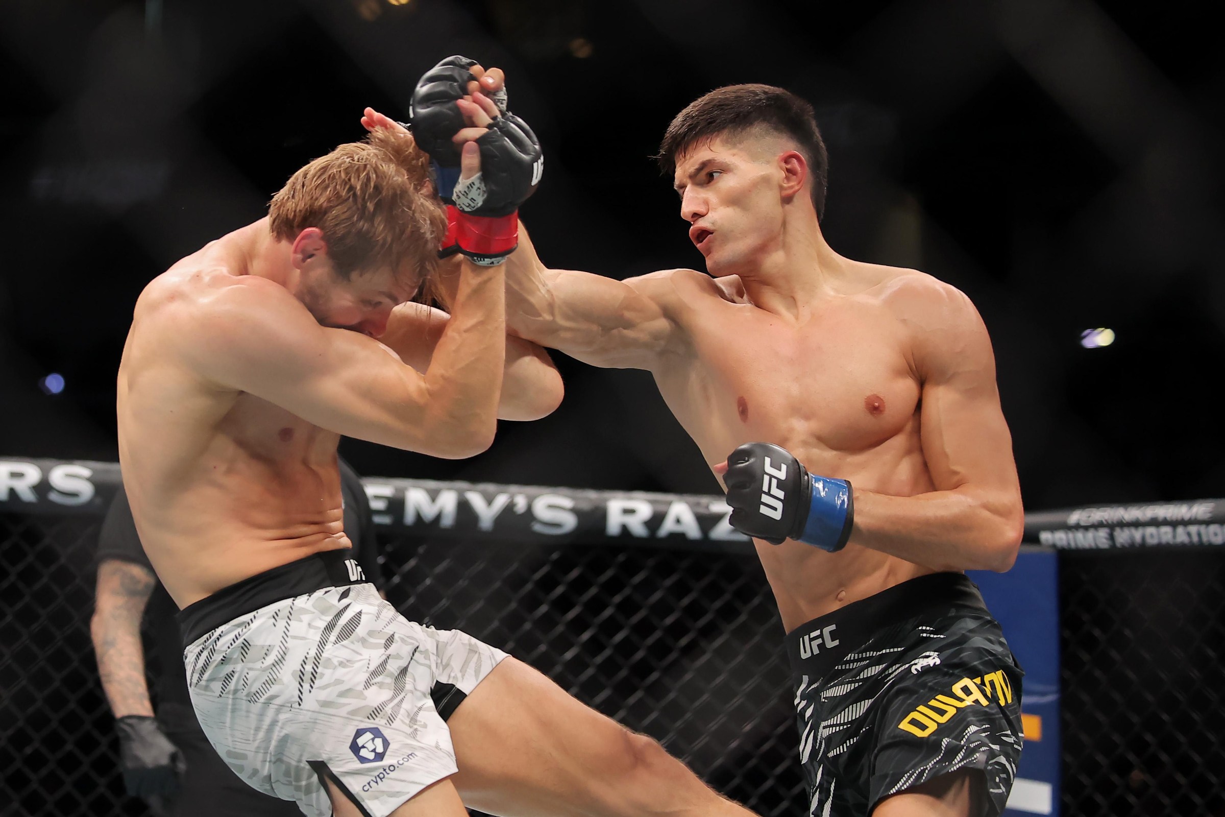 NEW ORLEANS, LOUISIANA - JULY 19: Islam Dulatov of Germany (R) strikes Adam Fugitt of the United States during their welterweight bout during UFC 318: Holloway vs Poirier 3 at the Smoothie King Center on July 19, 2025 in New Orleans, Louisiana. (Photo by Jonathan Bachman/Getty Images)