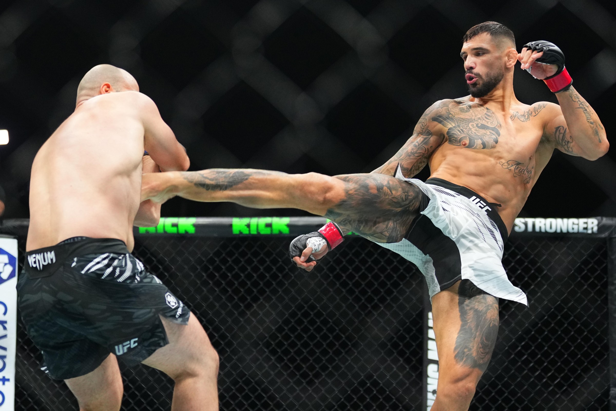 ABU DHABI, UNITED ARAB EMIRATES - OCTOBER 25: Aleksandar Rakic of Austria kicks Azamat Murzakanov of Russia in a light heavyweight fight during the UFC 321 event at Etihad Arena on October 25, 2025 in Abu Dhabi, United Arab Emirates. (Photo by Jeff Bottari/Zuffa LLC)