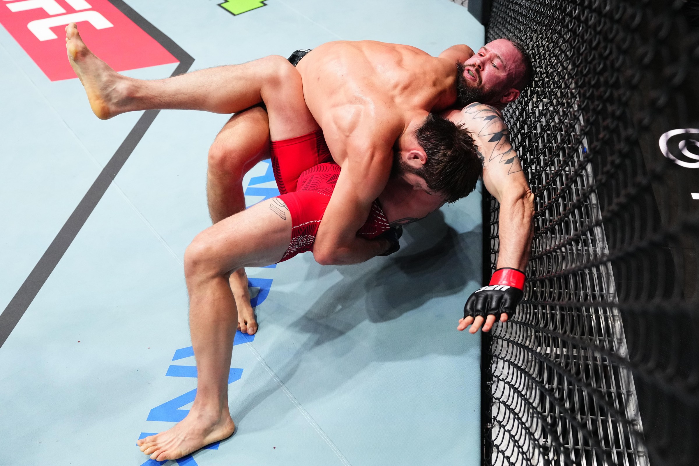 DOHA, QATAR - NOVEMBER 22: (L-R) Saygid Izagakhmaev takes down Nicolas Dalby of Denmark in a welterweight fight during the UFC Fight Night event at ABHA Arena on November 22, 2025 in Doha, Qatar. (Photo by Jeff Bottari/Zuffa LLC)