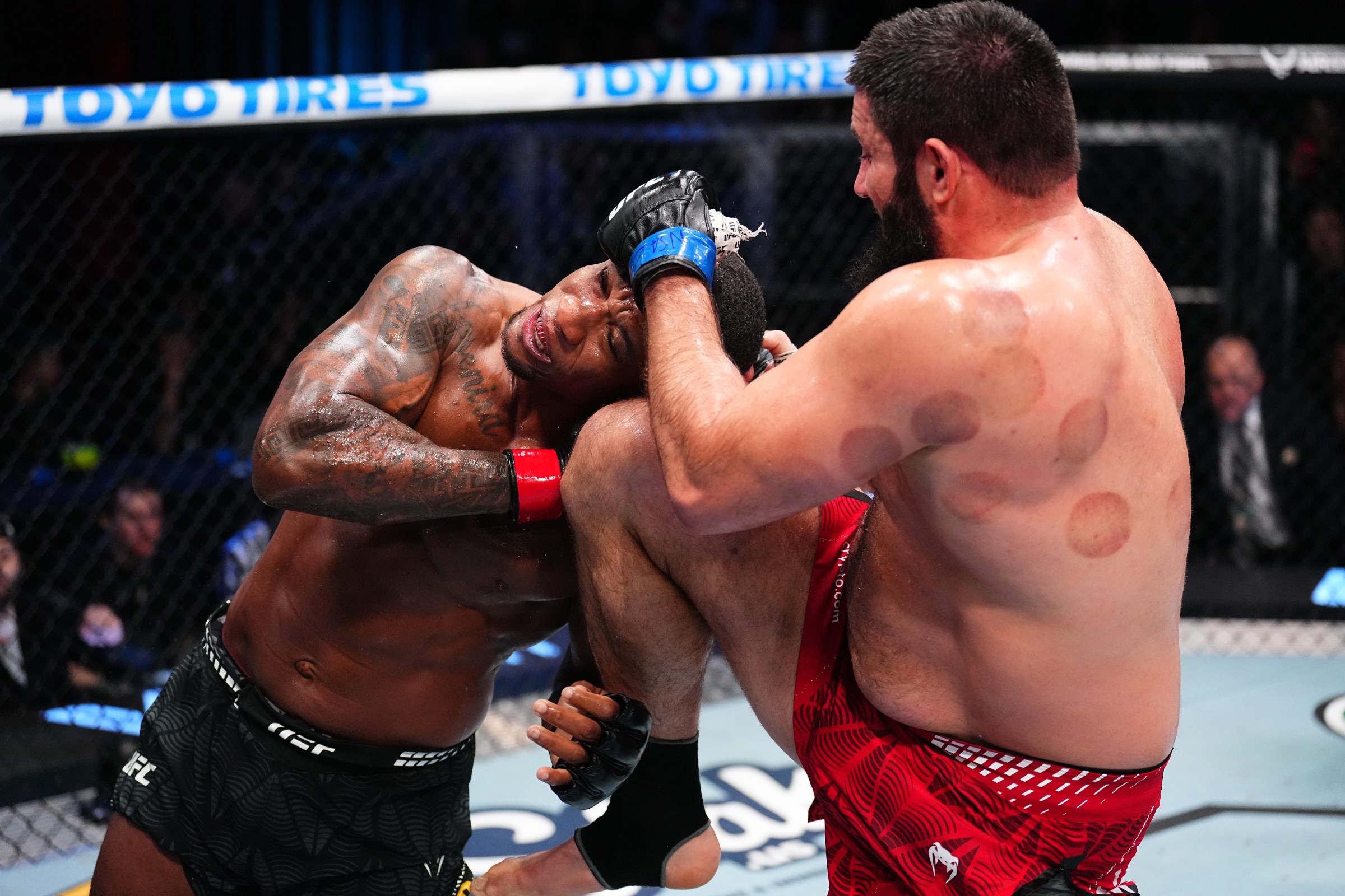 LAS VEGAS, NEVADA - FEBRUARY 07: (R-L) Rizvan Kuniev of Russia knees Jailton Almeida of Brazil in a heavyweight fight during the UFC Fight Night event at Meta APEX on February 07, 2026 in Las Vegas, Nevada. (Photo by Chris Unger/Zuffa LLC)