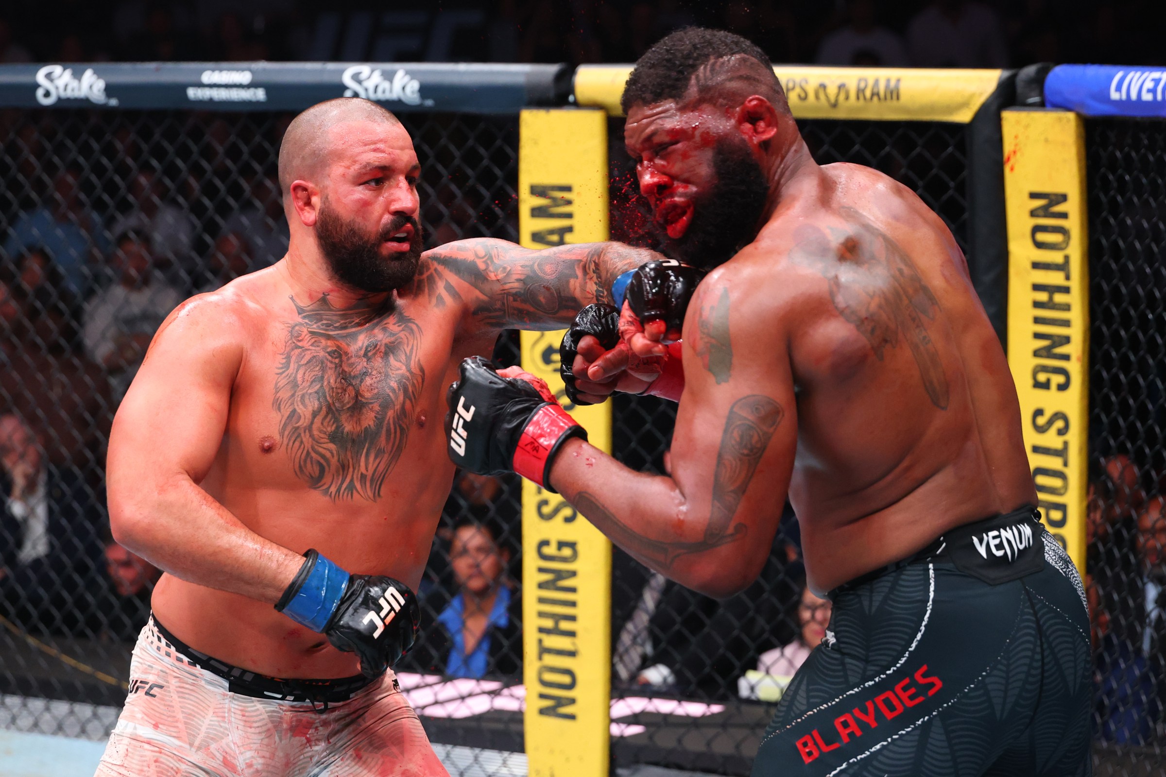 MIAMI, FLORIDA - APRIL 11: (L-R) Josh Hokit punches Curtis Blaydes in a heavyweight fight during the UFC 327 event at Kaseya Center on April 11, 2026 in Miami, Florida. (Photo by Ed Mulholland/Zuffa LLC)