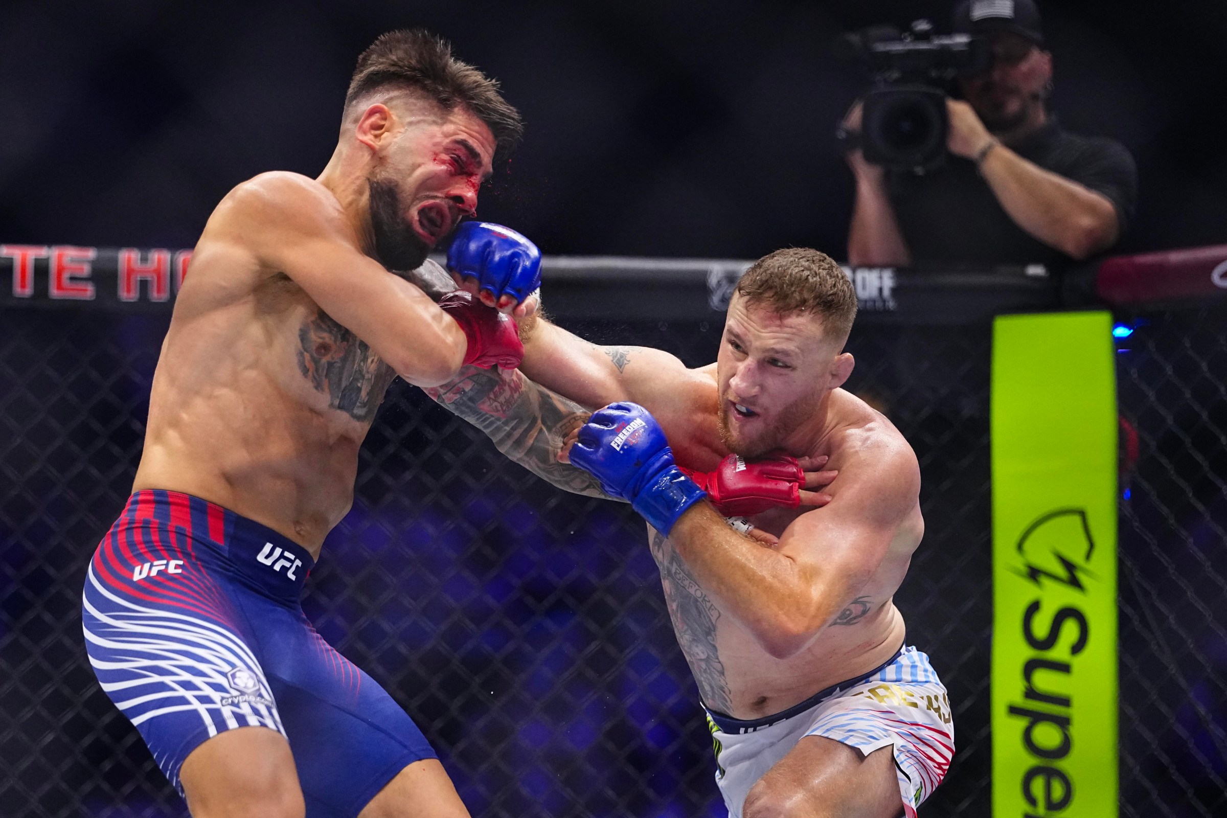 WASHINGTON, DC - JUNE 14: Justin Gaethje strikes Ilia Topuria of Spain in the UFC lightweight championship fight during the UFC Freedom 250 event on the South Lawn at the White House on June 14, 2026 in Washington, DC. (Photo by Chris Unger/Zuffa LLC)