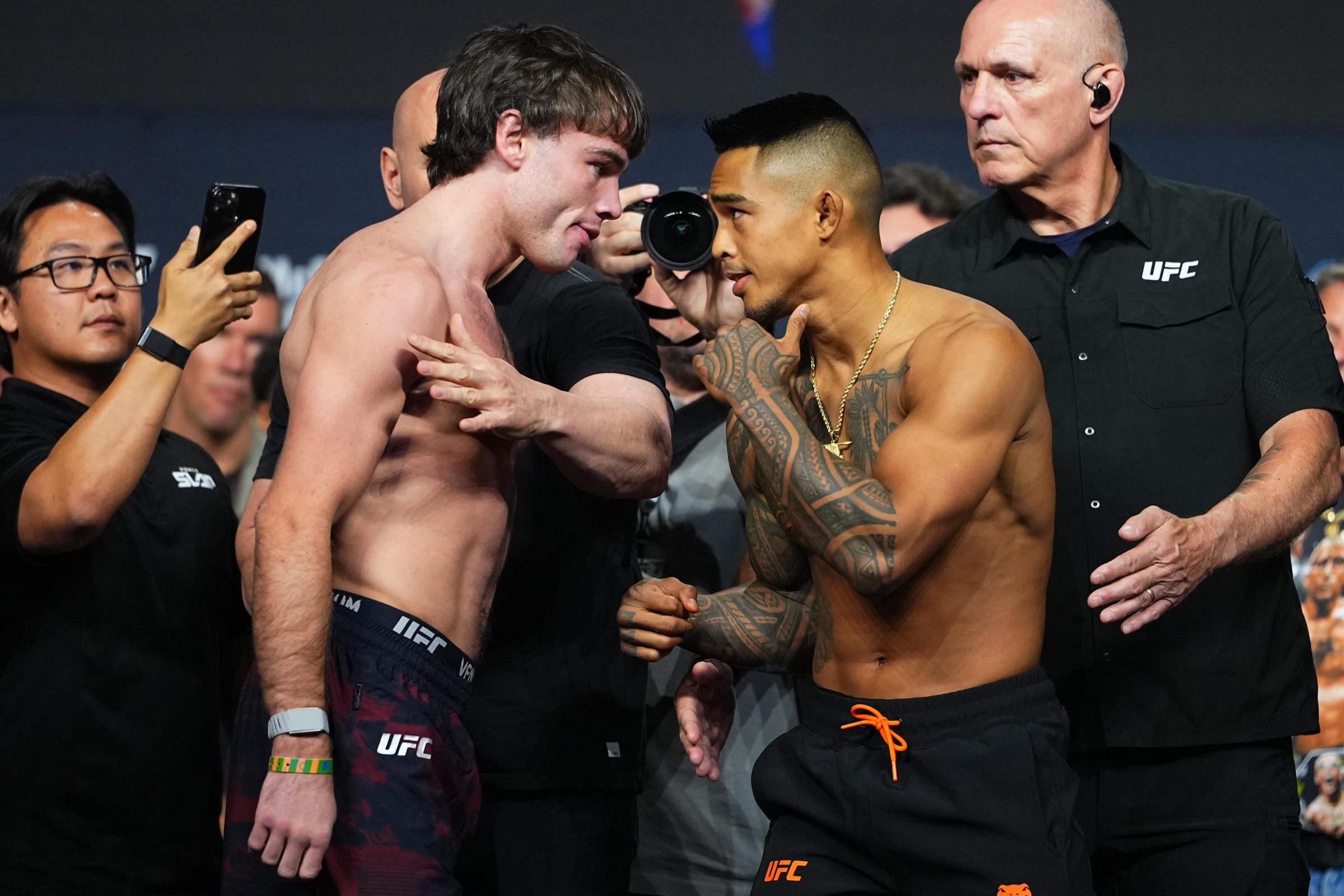 LAS VEGAS, NEVADA - JULY 10: (L-R) Luke Riley faces off against Kai Kamaka III during the UFC 329 ceremonial weigh-in at T-Mobile Arena on July 10, 2026 in Las Vegas, Nevada. (Photo by Jeff Bottari/Zuffa LLC)