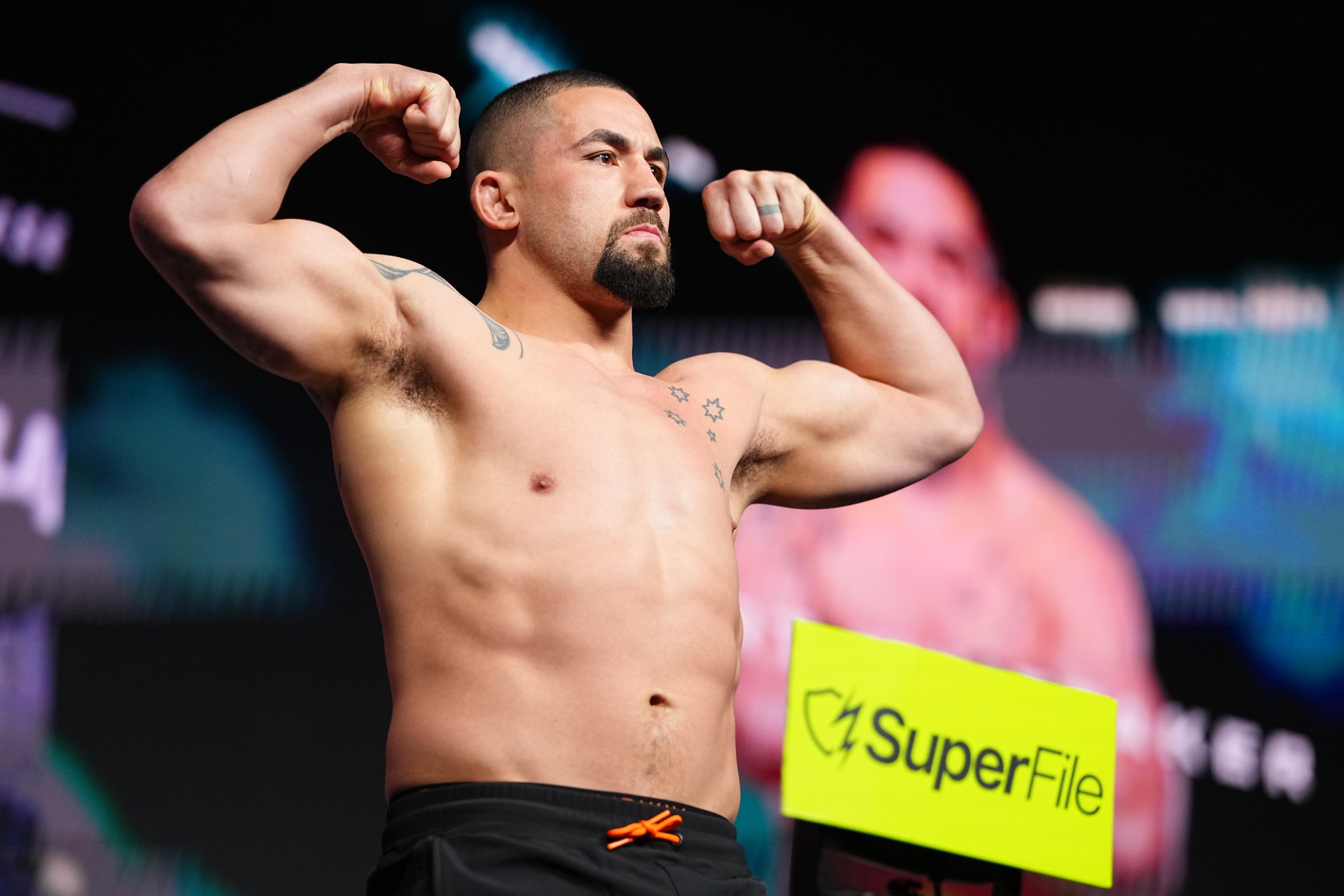 LAS VEGAS, NEVADA - JULY 10: Robert Whittaker steps on the scale during the UFC 329 ceremonial weigh-in at T-Mobile Arena on July 10, 2026 in Las Vegas, Nevada. (Photo by Chris Unger/Zuffa LLC)