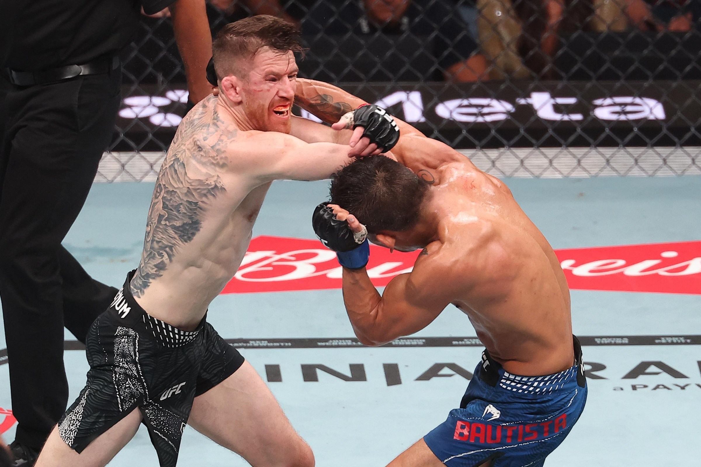 LAS VEGAS, NEVADA - JULY 11: (L-R) Cory Sandhagen strikes Mario Bautista in a bantamweight fight during the UFC 329 event at T-Mobile Arena on July 11, 2026 in Las Vegas, Nevada. (Photo by Ed Mulholland/Zuffa LLC)