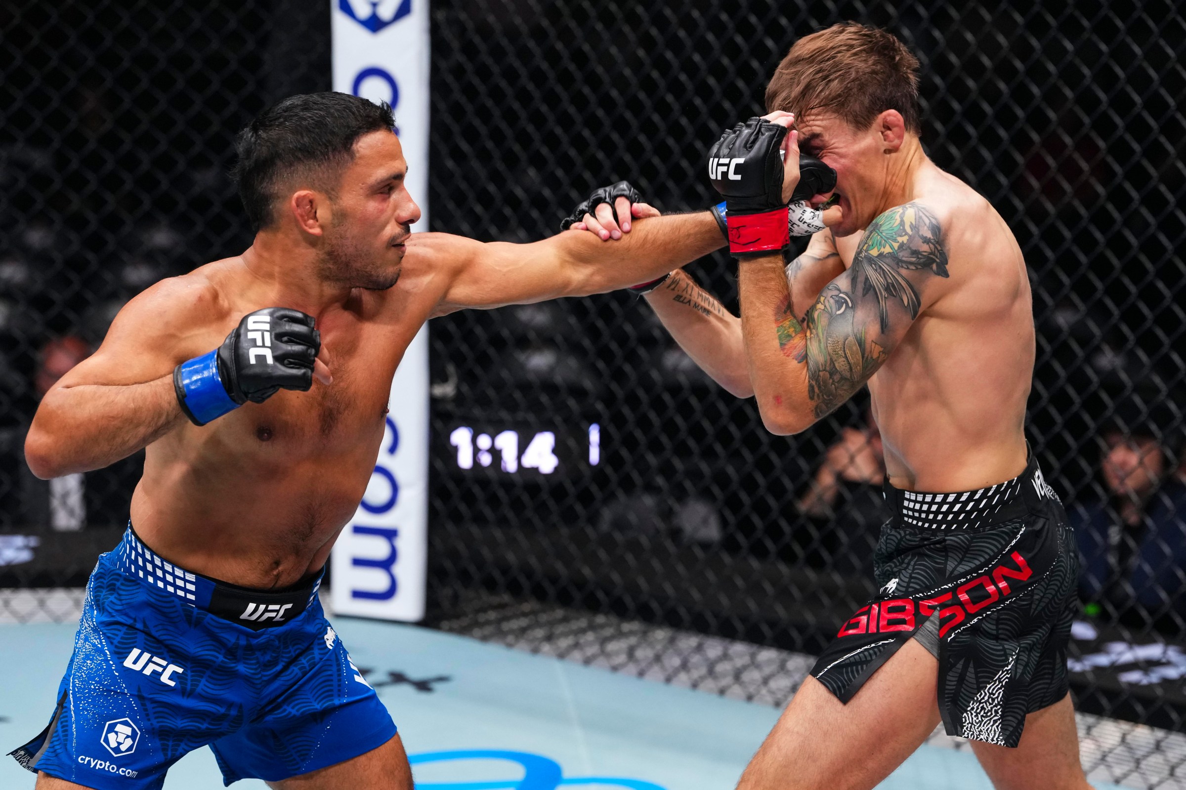 ABU DHABI, UNITED ARAB EMIRATES - JULY 24: Abdul Hussein throws a punch against Cody Gibson in their bantamweight fight during the UFC Fight Night event at Etihad Arena July 24, 2026 in Yas Island, Abu Dhabi, United Arab Emirates. (Photo by Josh Hedges/Zuffa LLC via Getty Images)