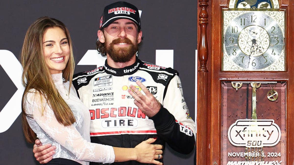 Ryan Blaney celebrates with Gianna Tulio in victory lane.