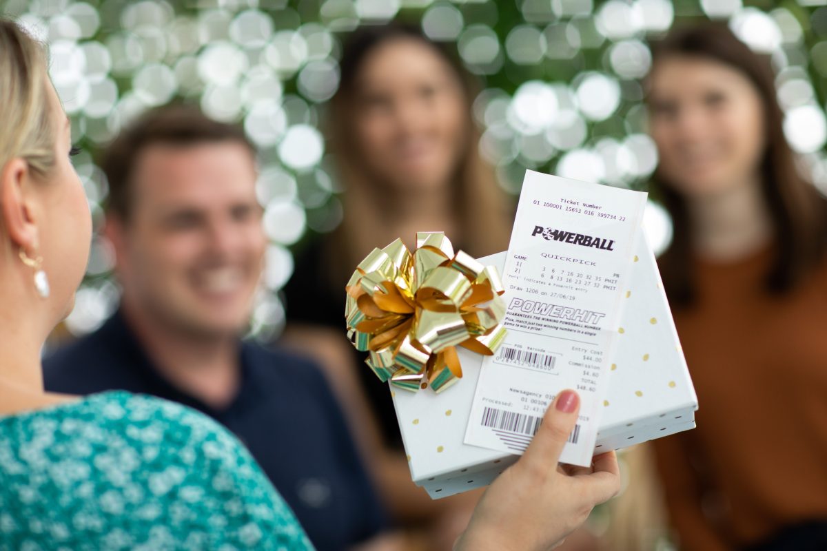 stock Powerball photo giving winnings to family