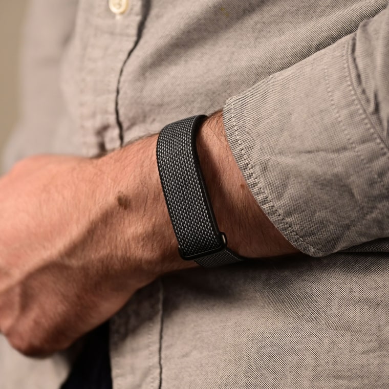 A close-up of the Google Fitbit Air on the wrist of the writer.