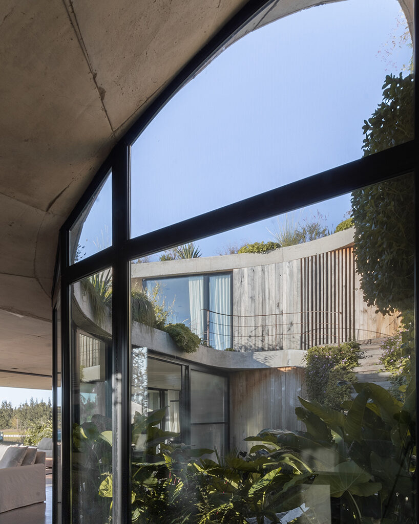 rooftop garden crowns concrete house shaped by spiraling patios