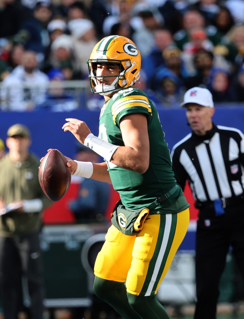 Green Bay Packers quarterback Jordan Love (10) looking to pass.