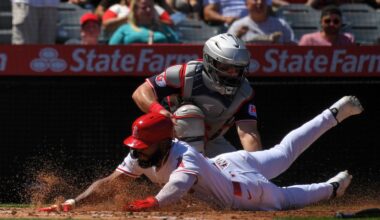 Los Angeles Angels' Luis Rengifo, below, is tagged out by Cleveland Guardians catcher Austin Hedges while trying to score after Jorge Soler hit into a fielder's choice during the third inning of a baseball game Sunday, April 6, 2025, in Anaheim, Calif.
