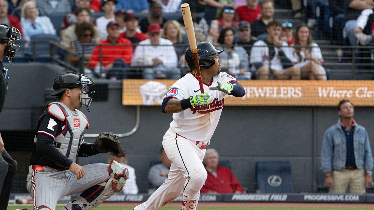 Cleveland Guardians' Jose Ramirez watches his RBI single off Minnesota Twins starting pitcher Bailey Ober as Alex Jackson looks on during the second inning of a baseball game, Wednesday, July 22, 2026, in Cleveland. (AP Photo/Phil Long)